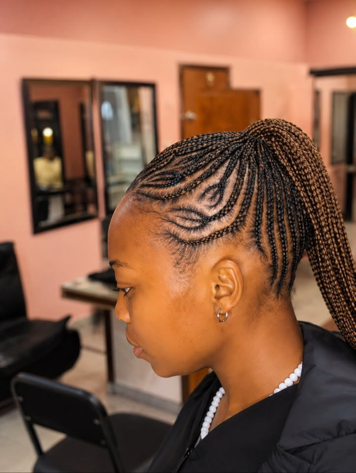 Feed-in cornrows styled into a sleek high ponytail