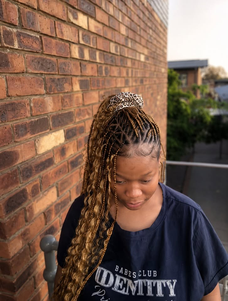 Tribal braids with curly ends and a leopard print scarf